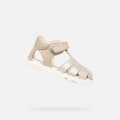 Sandały GEOX B SANDAL STEPPIEUP Złoty. Żółte sandały Geox, bez wzorów, ze skóry, bez obcasa, bez zapięcia. Za 207.99 zł.