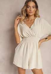 Beżowy Kombinezon Kopertowy z Gumką w Pasie Fandrea. Brązowe sukienki Renee, bez wzorów, z jeansu, eleganckie, bez kołnierzyka, bez ramiączek, kopertowe. Za 44.99 zł.