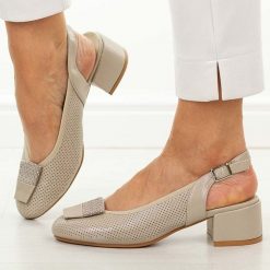 Złote sandały damskie na obcasie Potocki 12817. Żółte sandały POTOCKI, z aplikacjami, ze skóry, eleganckie, z okrągłym noskiem, bez obcasa, na obcasie, bez zapięcia. Za 179.00 zł.