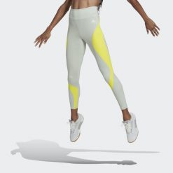 Legginsy Kobieta Adidas Hiit Colorblock zielony. Zielone legginsy Adidas, m, bez wzorów. W wyprzedaży za 198.05 zł.