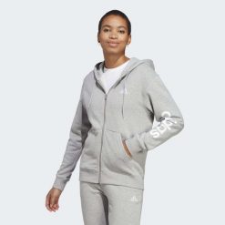 Bluza damska adidas Essentials Linear Full-Zip French Terry Hoodie. Białe bluzy Adidas, s, bez wzorów, z dresówki, z kapturem. Za 222.00 zł.
