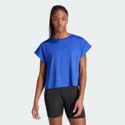 Koszulka Studio. Niebieskie bluzki Adidas, xs, bez wzorów, z materiału, sportowe, bez kołnierzyka, bez ramiączek. W wyprzedaży za 136.85 zł.
