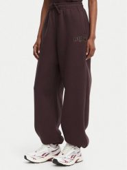 Reebok Spodnie dresowe Iza RK25687CCW Brązowy ciemny Regular Fit. Brązowe spodnie dresowe Reebok, m, bez wzorów, z bawełny. Za 199.99 zł.