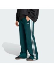 Adidas Spodnie dresowe Firebird KG3701 Zielony Loose Fit. Zielone spodnie dresowe Adidas, xs, bez wzorów, z dresówki. Za 299.99 zł.