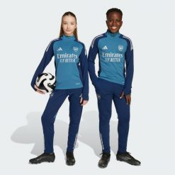 Spodnie treningowe Arsenal Tiro 25 Competition. Niebieskie spodnie sportowe Adidas, bez wzorów, z dresówki, na fitness i siłownię. Za 259.00 zł.