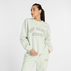 Bluza damska New Balance WT43516NUM – miętowa. Zielone bluzy New Balance, xl, bez wzorów, z bawełny, bez kaptura. Za 129.99 zł.