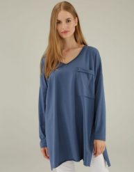 Niebieska bluzka z bawełny. Niebieskie bluzki Unisono, m, bez wzorów, z bawełny, bez kołnierzyka, bez ramiączek. Za 139.00 zł.