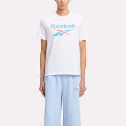 Koszulka damska Reebok Gym & Pilates. Bluzki Reebok, m, bez wzorów, z bawełny, klasyczne, bez kołnierzyka, bez ramiączek. W wyprzedaży za 89.99 zł.