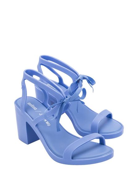 Melissa Sandały w kolorze fioletowym rozmiar: 41/42. Różowe sandały Melissa, bez wzorów, z otwartym noskiem, bez obcasa, na koturnie, bez zapięcia. Za 231.95 zł.