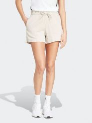 Adidas Szorty w kolorze kremowym rozmiar: S. Brązowe szorty Adidas, bez wzorów. Za 101.45 zł.