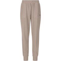 Damskie spodnie dresowe Athlecia Reiley. Brązowe spodnie materiałowe Athlecia, na co dzień, bez wzorów, z dresówki. Za 251.50 zł.