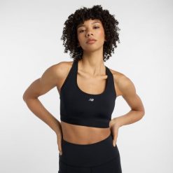 Biustonosz New Balance WB51032BK – czarny. Czarne biustonosze New Balance, bez wzorów, z materiału. Za 249.99 zł.