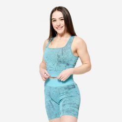 Koszulka fitness damska Domyos crop top. Niebieskie topy DOMYOS, l, bez wzorów, z elastanu, bez kołnierzyka, bez ramiączek. Za 89.99 zł.
