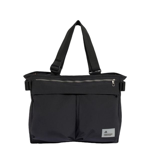 TORBA CITY TECH TOTE BAG. Zielone torby na ramię Adidas, bez wzorów, z materiału, biznesowe, na ramię, bez dodatków. Za 299.00 zł.