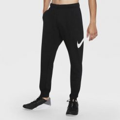 Spodnie treningowe damskie Nike Taper. Czarne spodnie dresowe Nike, s, bez wzorów, na fitness i siłownię. Za 511.00 zł.
