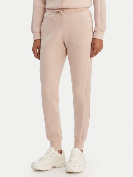 Guess Spodnie dresowe V2YB18 K7UW2 Beżowy Regular Fit. Brązowe spodnie dresowe Guess, m, z aplikacjami, z dresówki. Za 369.99 zł.