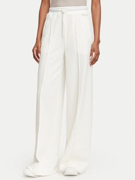 Guess Spodnie materiałowe W6YB13 K4363 Kremowy Relaxed Fit. Białe spodnie materiałowe Guess, xs, z aplikacjami, z bawełny. Za 390.99 zł.