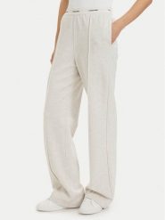 Calvin Klein Jeans Spodnie dresowe LV047G253G Kremowy Relaxed Fit. Białe spodnie dresowe Calvin Klein Jeans, xl, bez wzorów, z bawełny. Za 409.99 zł.