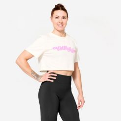 Koszulka fitness damska Domyos crop top. Białe topy DOMYOS, m, bez wzorów, z bawełny, bez kołnierzyka, bez ramiączek. W wyprzedaży za 39.99 zł.