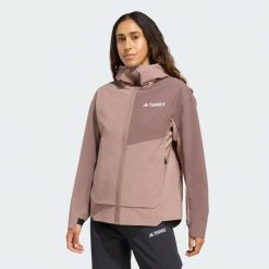 Kurtka Terrex Multi Softshell. Brązowe kurtki sportowe Adidas, bez wzorów, z materiału, bez kaptura, trekkingowe. Za 529.00 zł.