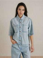 Jeansowa koszula z krótkim rękawem - niebieski. Niebieskie koszule Sinsay, l, bez wzorów, z jeansu, bez kołnierzyka, bez ramiączek. Za 59.99 zł.