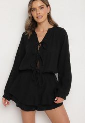 Czarny Wiązany Bawełniany Kombinezon Boho z Falbankami i Wiązaniem Lalelia. Czarne sukienki Born2be, na co dzień, na lato, uniwersalny, bez wzorów, z bawełny, boho, bez kołnierzyka, bez ramiączek, proste. Za 159.99 zł.