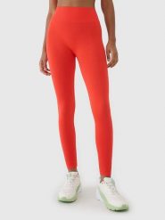 4F Legginsy funkcyjne w kolorze pomarańczowym rozmiar: M/L. Pomarańczowe legginsy sportowe 4f, l, bez wzorów, z materiału, na fitness i siłownię. Za 74.81 zł.