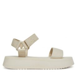 Sandały Calvin Klein Jeans. Sandały Calvin Klein Jeans, bez wzorów, z jeansu, bez obcasa, na koturnie, bez zapięcia. Za 229.99 zł.