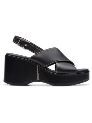 Clarks Skórzane sandały "Manon Wish" w kolorze czarnym na koturnie rozmiar: 38. Czarne sandały Clarks, bez wzorów, z otwartym noskiem, bez obcasa, na koturnie, bez zapięcia. Za 184.89 zł.