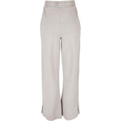 Spodnie z rozcięciem dla kobiet Urban Classics Heavy Terry Garment Dye GT. Szare spodnie materiałowe Urban Classics, na co dzień, bez wzorów, długie. Za 267.50 zł.