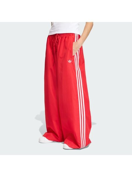 Adidas Spodnie dresowe Firebird Adilenium KD6299 Czerwony Regular Fit. Czerwone spodnie dresowe Adidas, xs, bez wzorów, z dresówki. Za 379.99 zł.