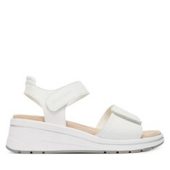 Sandały Caprice. Białe sandały Caprice, bez wzorów, bez obcasa, na koturnie, bez zapięcia. Za 329.99 zł.