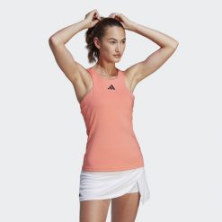 Damski tank top adidas Y-Tank Coral Fusion. Brązowe koszulki sportowe Adidas, bez wzorów, z materiału, bez ramiączek, tenisowe. Za 234.05 zł.
