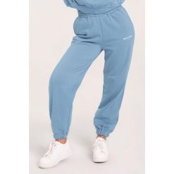 Spodnie fitness damskie Gym Glamour dresowe. Niebieskie spodnie dresowe GYM GLAMOUR, m, bez wzorów, z dresówki, na fitness i siłownię. Za 189.99 zł.