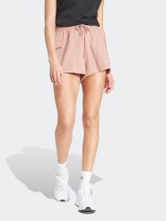 Adidas Szorty dresowe w kolorze jasnoróżowym rozmiar: M. Różowe szorty Adidas, bez wzorów, z dresówki. Za 92.42 zł.
