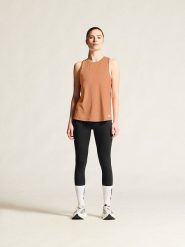 Craft Top sportowy "Collective" w kolorze beżowym rozmiar: XL. Pomarańczowe koszulki sportowe Craft, bez wzorów, z materiału, bez ramiączek, outdoorowe. Za 86.95 zł.