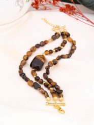 Pierres de Jade Pozłacana bransoletka z elementami ozdobnymi rozmiar: onesize. Brązowe bransoletki Pierres de Jade, pozłacane. Za 92.64 zł.