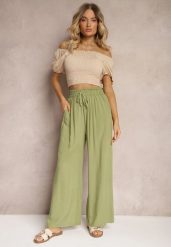 Jasnozielone Spodnie z Bawełny Typu Palazzo High Waist z Gumką w Talii Nelsaria. Zielone spodnie materiałowe Renee, na co dzień, l, bez wzorów, z bawełny, z podwyższonym stanem. Za 39.99 zł.