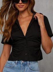 LA Angels Bluzka w kolorze czarnym rozmiar: M. Czarne bluzki LA Angels, m, bez wzorów, bez kołnierzyka, bez ramiączek. Za 122.09 zł.