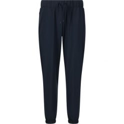 Damskie spodnie dresowe Athlecia Austberg. Niebieskie spodnie dresowe Athlecia, bez wzorów, z dresówki. Za 258.50 zł.