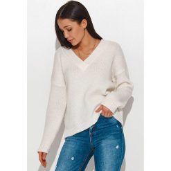 Numinou Sweter w kolorze kremowym rozmiar: onesize. Brązowe swetry Numinou, bez wzorów, z wełny, bez ramiączek. Za 79.21 zł.