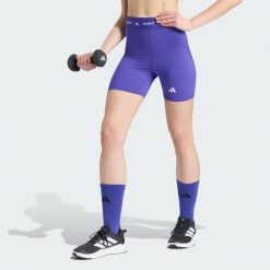 Krótkie legginsy TECHFIT. Fioletowe legginsy Adidas, l, bez wzorów, z elastanu, z podwyższonym stanem, krótkie. Za 119.00 zł.
