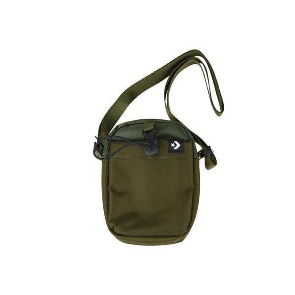 Saszetka na ramię Converse Comms Pouch 1,5 L. Zielone torby na ramię Converse, bez wzorów, z materiału, sportowe, na ramię, bez dodatków. Za 59.99 zł.