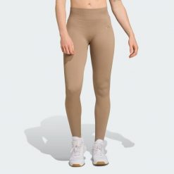 Długie dzianinowe legginsy do ćwiczeń Essentials. Zielone legginsy Adidas, xs, bez wzorów, z dzianiny, długie. Za 217.30 zł.