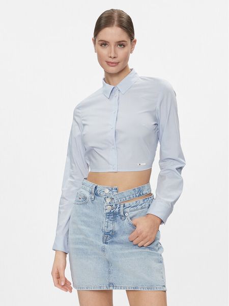 Tommy Jeans Koszula DW0DW17344 Błękitny Slim Fit. Niebieskie koszule Tommy Jeans, l, bez wzorów, z jeansu, bez kołnierzyka, bez ramiączek. Za 269.99 zł.