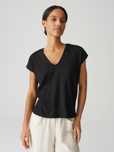 OPUS Koszulka w kolorze czarnym rozmiar: 44. Czarne bluzki Opus, bez wzorów, bez kołnierzyka, bez ramiączek. Za 83.22 zł.