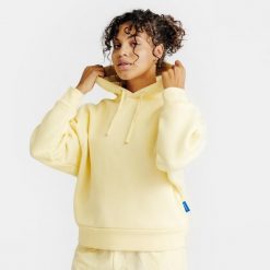 Bluza z kapturem damska Elementals. Żółte bluzy sportowe DECATHLON, s, bez wzorów, z bawełny, z kapturem. Za 179.99 zł.