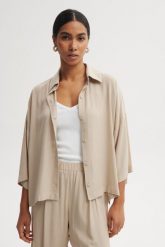 KOSZULA MEL PIASKOWA S - Flawless. Koszule Flawless, s, bez wzorów, z materiału, klasyczne, bez kołnierzyka, bez ramiączek. Za 397.00 zł.