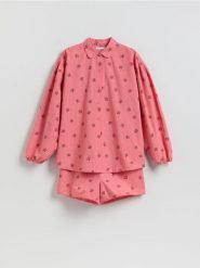 Dwuczęściowa piżama we wzory - intenstywna czerwień. Czerwone piżamy Reserved, bez wzorów, z bawełny, bez ramiączek. Za 149.99 zł.