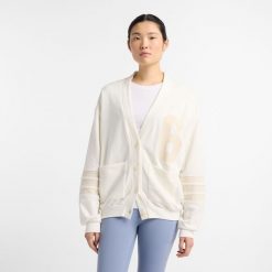 Kardigan damski New Balance WT51515SST – beżowy. Brązowe kardigany New Balance, m, bez wzorów, z bawełny. Za 249.99 zł.